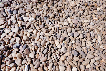 Texture of small stone or pebbles background. Sea stones in the garden