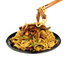 Beef in black bean sauce with egg noodles and cashew nuts meal with wood chopsticks isolated on a white background