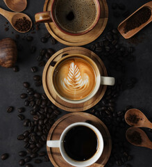 Cup of coffee and Coffee composition on black background. Copy space. Top view. Flat lay.