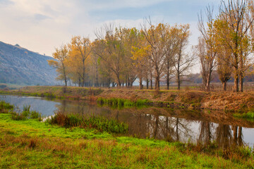 Sunrise over a misty small river