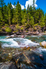 Fototapeta na wymiar The streams and turbulence in McDonald Creek, in Glacier National Park, Montana.