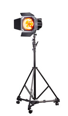 Photography studio flash on a lighting stand isolated on white background.