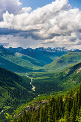 Naklejka premium The mountains and valleys in Glacier National Park, Montana, on a cloudy day.