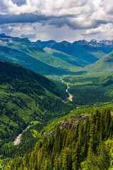 Fototapeta premium The mountains and valleys in Glacier National Park, Montana, on a cloudy day.