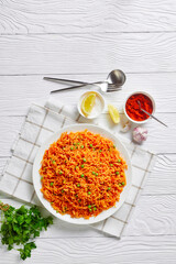 Tomato onion green peas rice on a plate