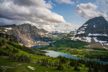 The hidden lake and mountains in Glacier National Park, in Montana, on a cloudy day.