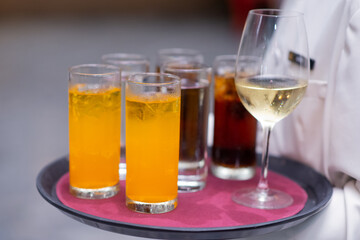 waitress are holding beverage tray for party guest