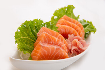 Sliced salmon sashimi on ice