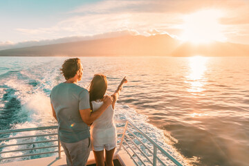 Cruise ship vacation travel tourists couple watching sunset on deck summer travel. lady pointing at sun to man tourist relaxing on Caribbean holidays. - obrazy, fototapety, plakaty
