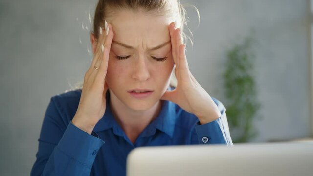 business, office, school and education concept - stressed businesswoman with computer at work