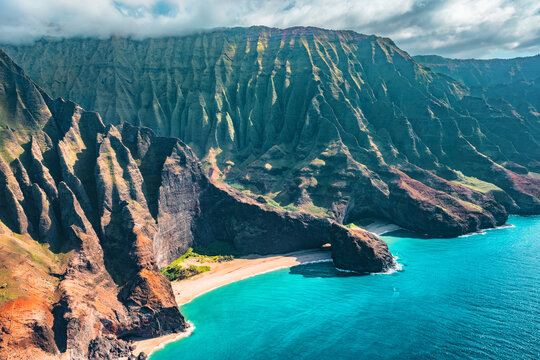 Napali coast on Kauai North shore island, Hawaii. Aerial view of famous landscape with beach, mountains and rugged ridges.