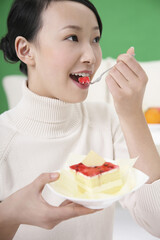 Woman eating cake