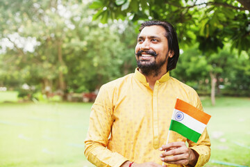 Fototapeta premium Indian patriot with national flag on Independence day of India