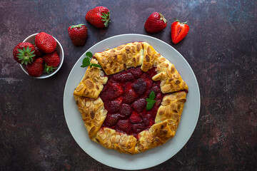 Homemade fresh-baked strawberry open pie galette