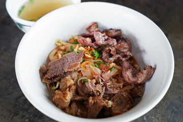 Close up dry beef noodles with soup