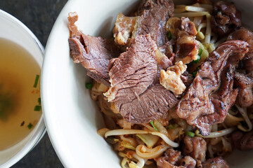 Close up dry beef noodles with soup