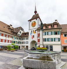 historic old town of Willisau in canton Lucerne with city gate and fountain