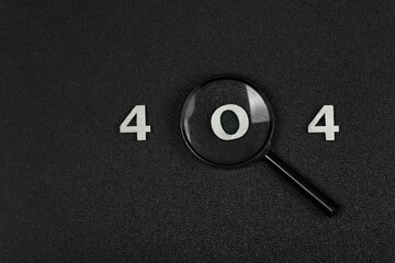 Numerals 404 and magnifying glass on black background. Error concept