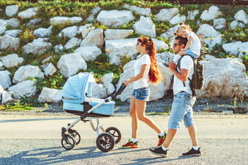 family walks with a child in the open air