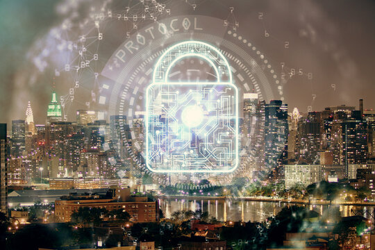 Lock icon hologram on city view with skyscrapers background multi exposure. Data security concept.
