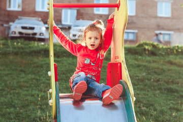 Fototapeta na wymiar children play on the slide