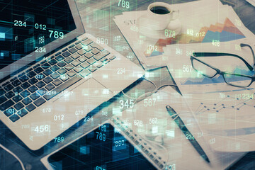Double exposure of table with computer on background and data theme drawing. Concept of innovation.