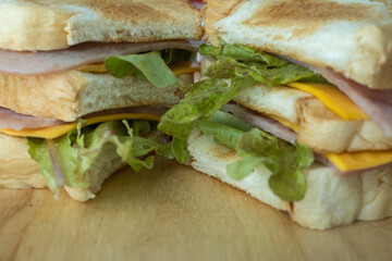 home made sandwich on wood table natural light