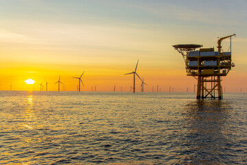 Fototapeta na wymiar Beautiful sunset at the North Sea offshore wind farm