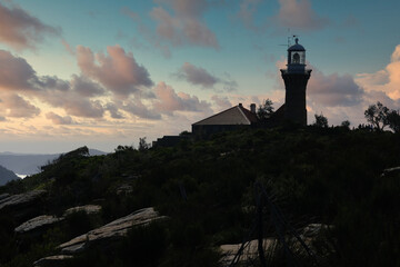 Fototapeta na wymiar lighthouse in the mountain at sunset