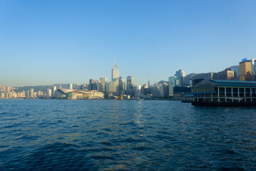 Fototapeta premium Hong Kong Convention and Exhibition Centre sun setting on it