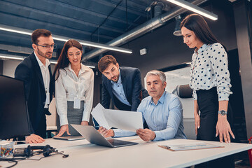 Creative business people working on business project in office