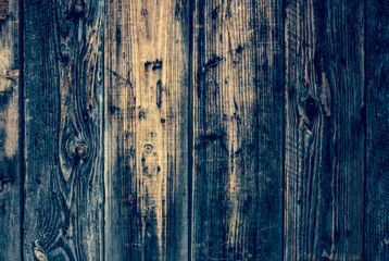 Fototapeta na wymiar Texture of an old weathered wooden board with peeling paint. Vintage rough grunge background