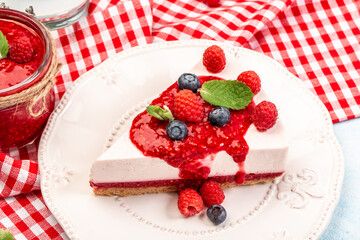 a piece of raspberry cheesecake. No Bake raspberries Cheesecake raspberry jam. Food recipe background. Close up