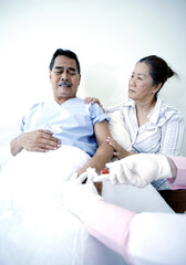 Fototapeta premium Elderly man afraid of injection
