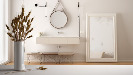 White table top or shelf with straws, dry plants, ornament, ears, sheaf, branch in vase, over white bathroom with sink, mirror and decors, modern minimal interior design