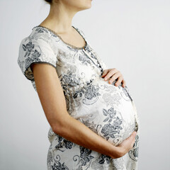 Pregnant woman touching her stomach