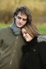 Fototapeta premium Happy couple leaning on each other