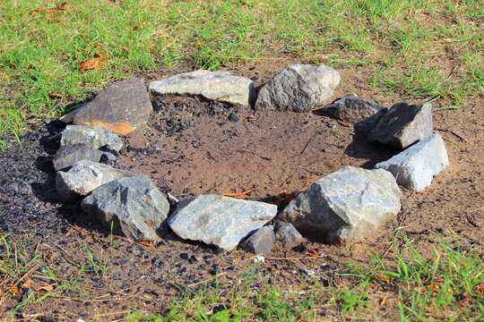 Empty Clear Fire Place On Ground With Stone Fence Close Up On Camping On Sunny Summer Day, Safety Campfire Rules