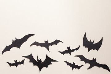 Black bats paper cut background.