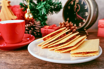 Cookie pine apple on white dish with red cup on the table