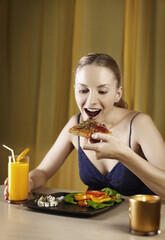 Woman enjoying her pizza and salad platter