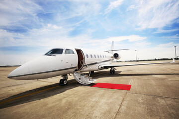 Fototapeta na wymiar Private airplane with red carpet