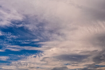 Naklejka na ściany i meble White fluffy clouds on clear blue sky. Nature background.