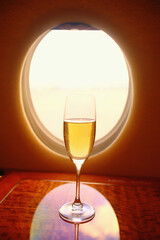 Champagne flute in a private jet