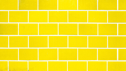 Abstract colorful yellow seamless brick tiles wall texture background