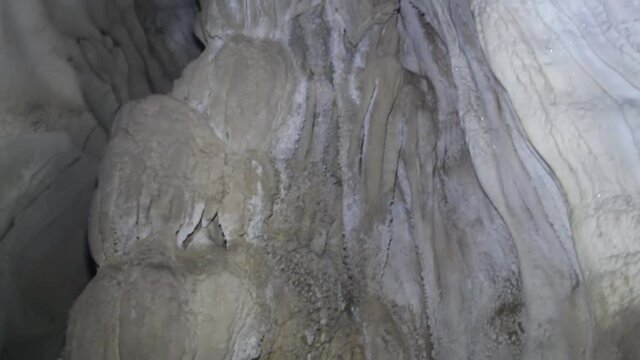 Caveology. Stalactites (congelation, helictite) in the cave in the form of frozen inhabitants of the sea floor and jellyfish and sea flower; anemon. Laos
