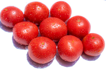Red tomatoes on a white background