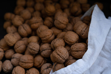 Ripe walnuts on a wooden background