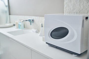 Modern towel warmer on the counter in spa salon