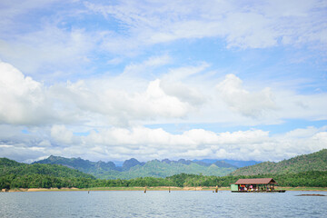 The house that is on the water, with beautiful mountains and sky as a background